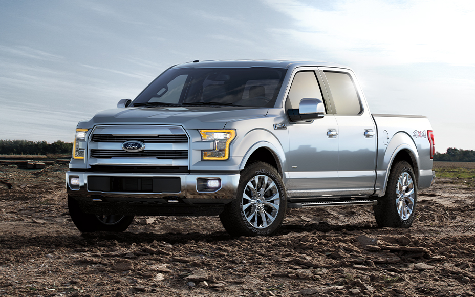 2015 Silver F150 parked on dirt